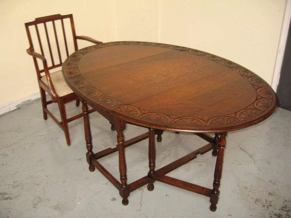 Oval oak drop leaf dining table