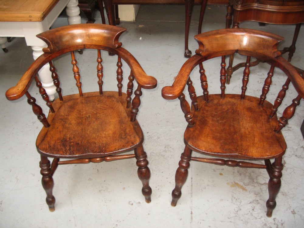 Pair of victorian smoker  bow arm chairs View VIII