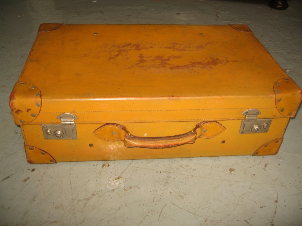 Light tan leather suit case