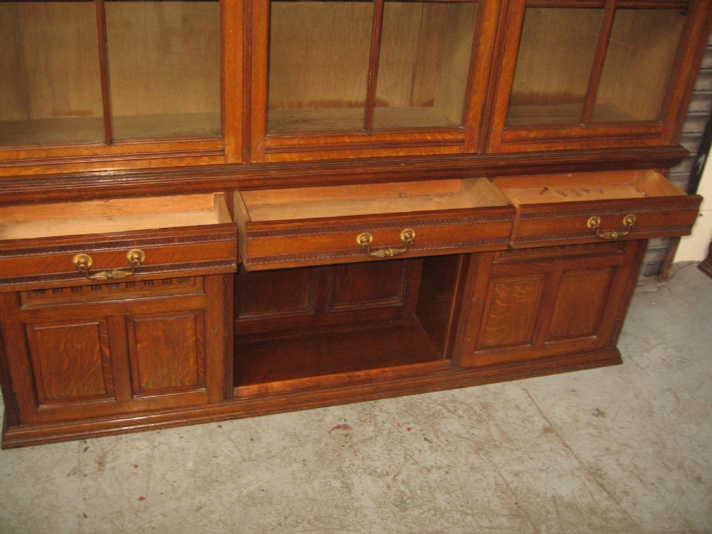 Oak three door bookcase View IV