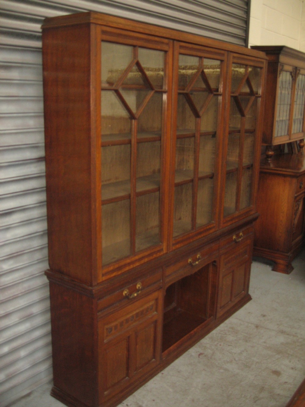 Oak three door bookcase View VII