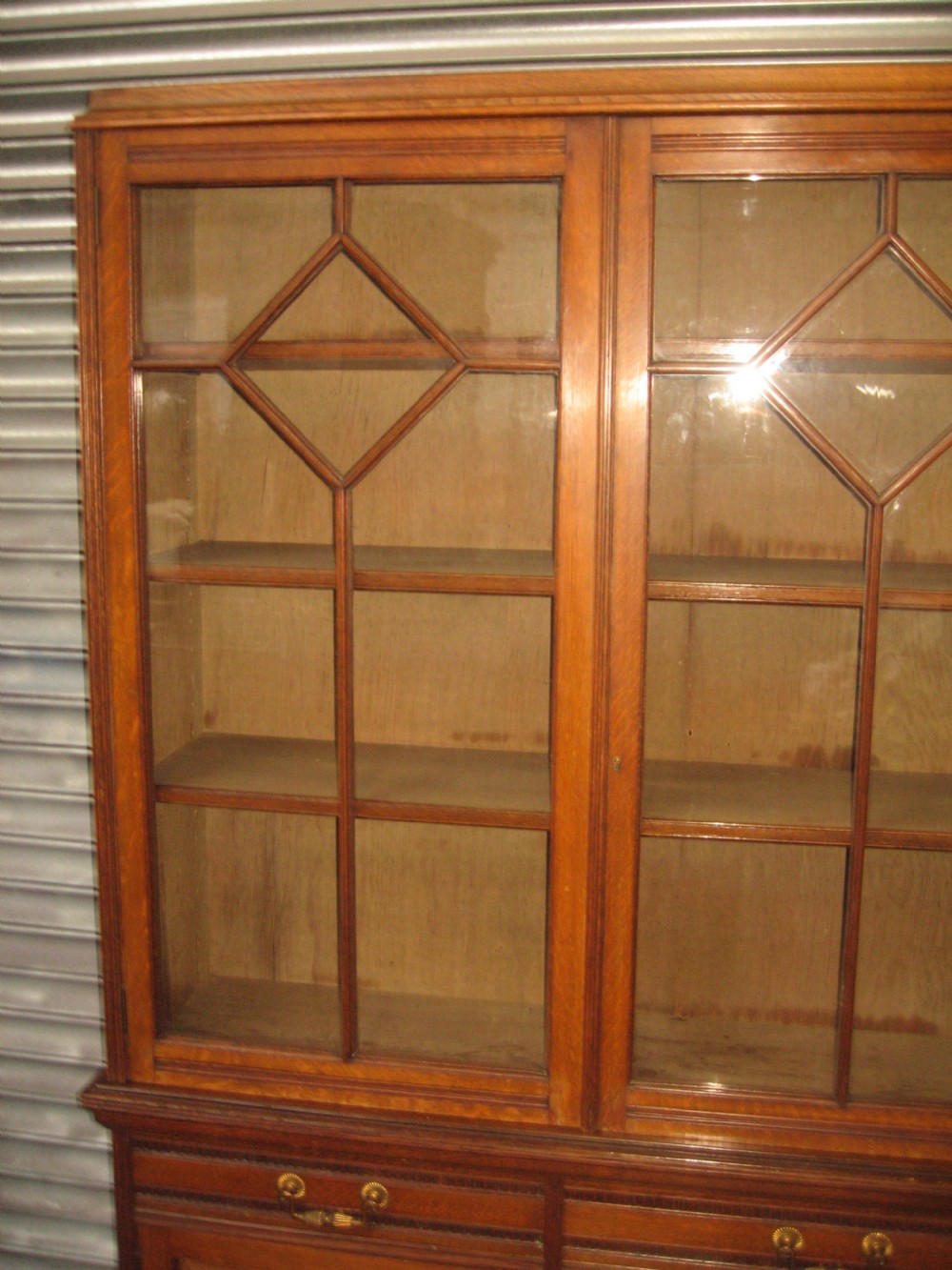 Oak three door bookcase View VIII