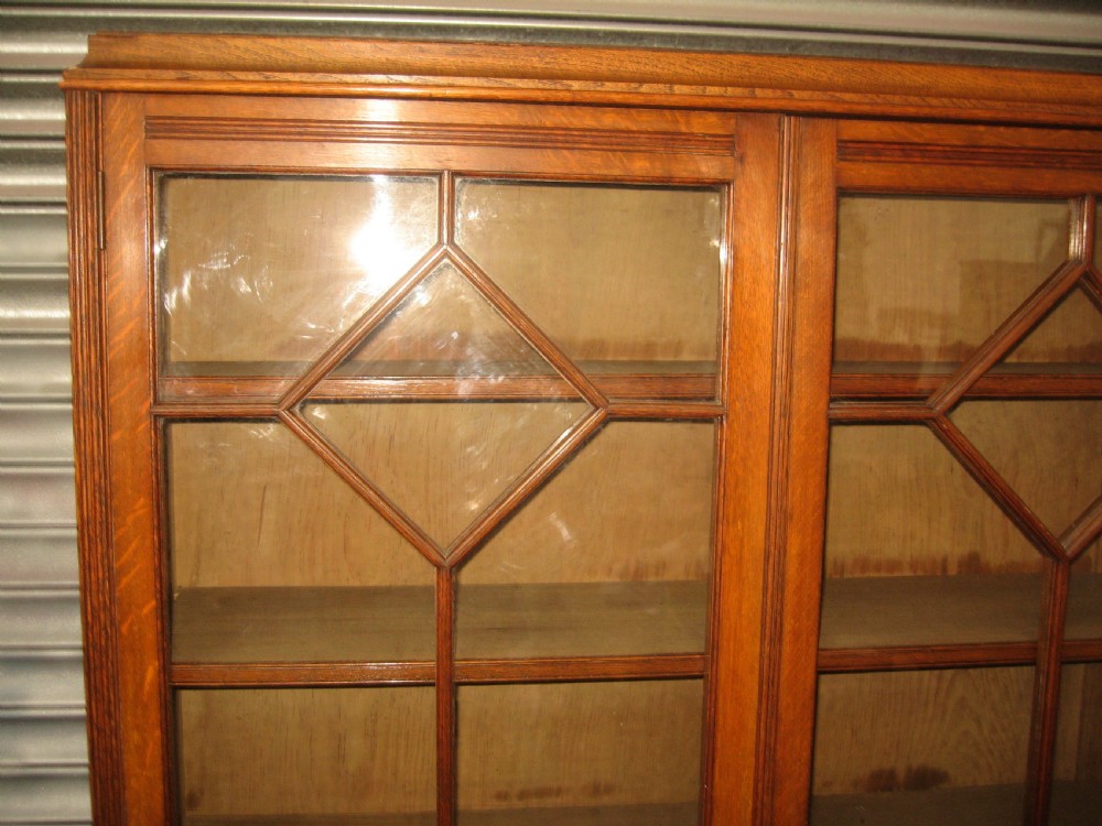 Oak three door bookcase View IX