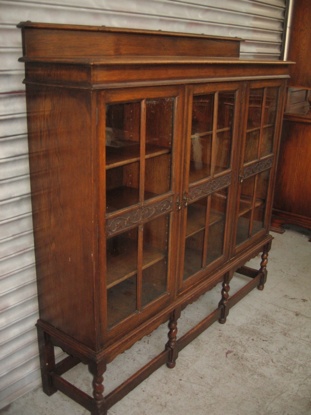 Oak three door  bookcase View IV