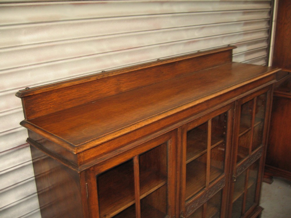 Oak three door  bookcase View VIII