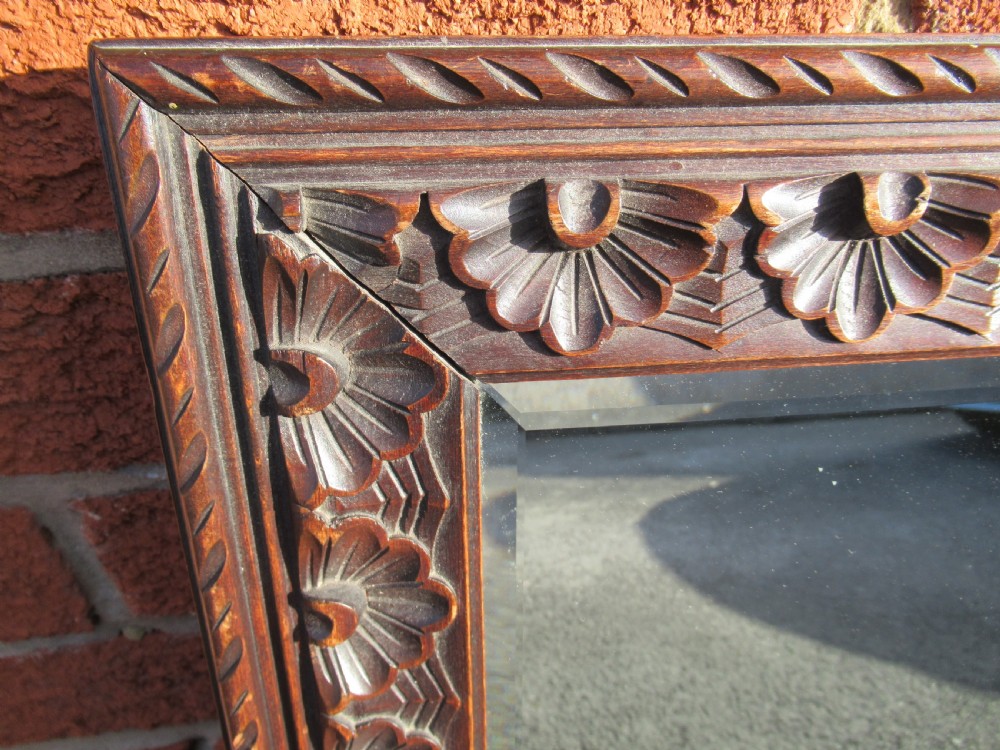 Pair of carved oak framed  wall mirrors View II