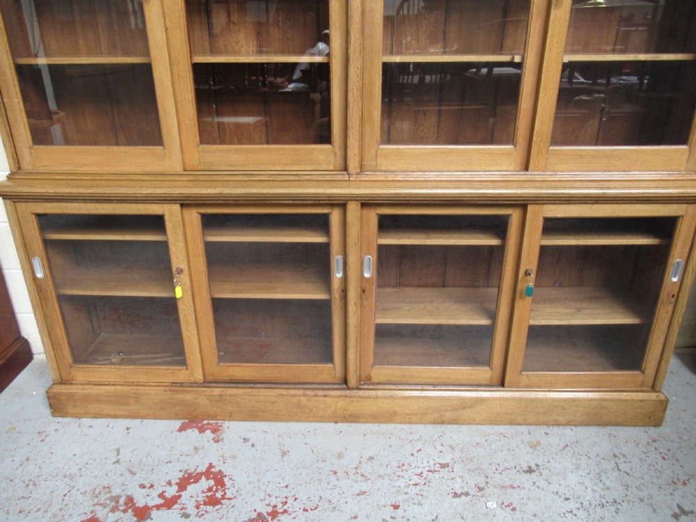 Large light oak bookcase  with sliding glass doors View III