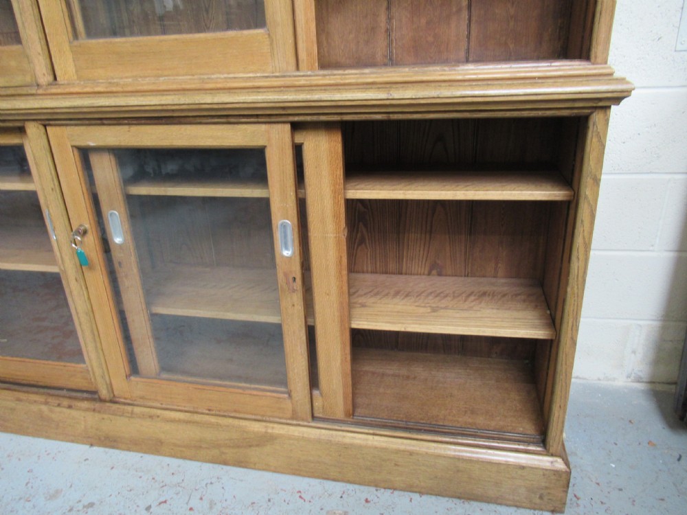 Large light oak bookcase  with sliding glass doors View VI