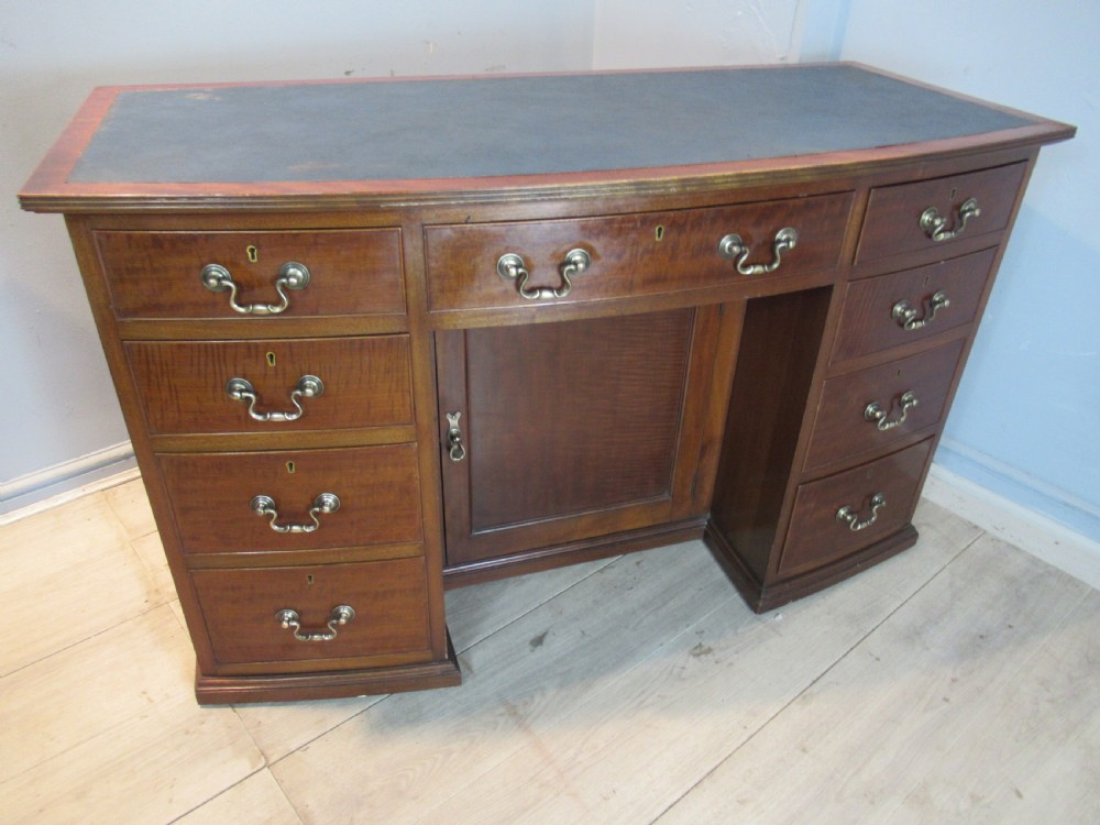 Mahogany bow front desk 