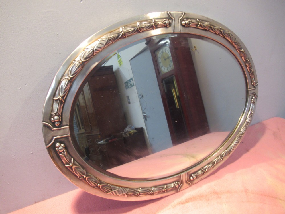 Oval art deco period  polished framed  wall mirror