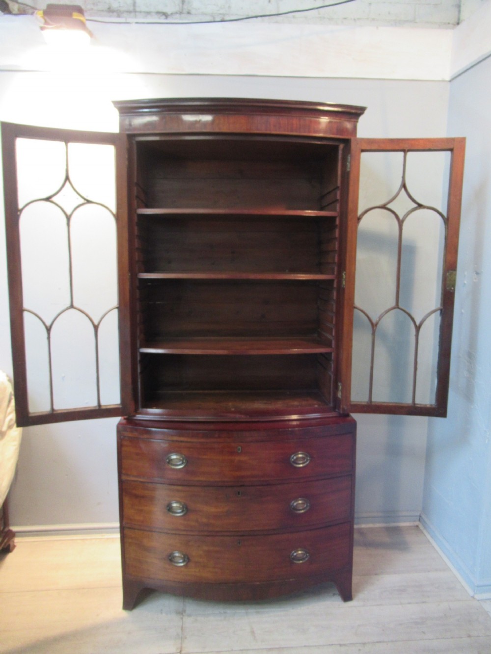 Antique mahogany  bow front bookcase on chest