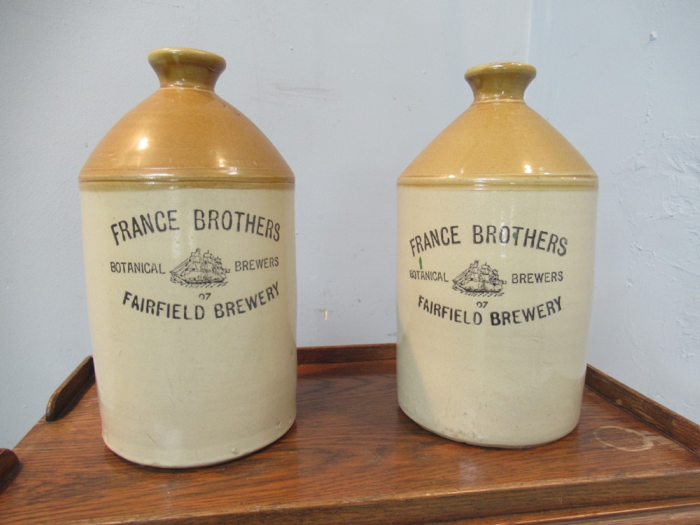 Pair of early 20th century earthenware Ale  jugs