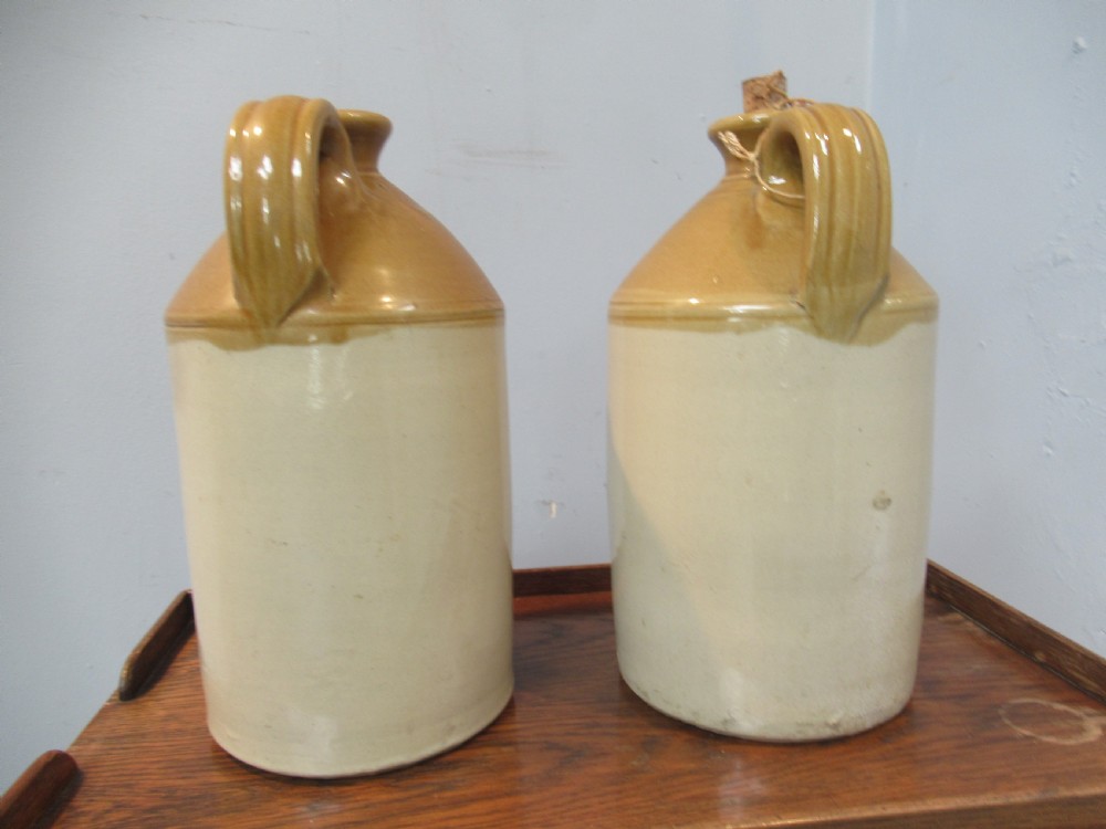 Pair of early 20th century earthenware Ale  jugs View III