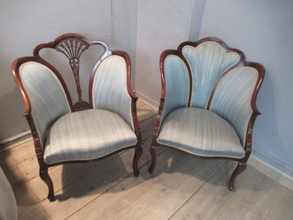 A similar  pair of Edwardian  mahogany arm chairs View II