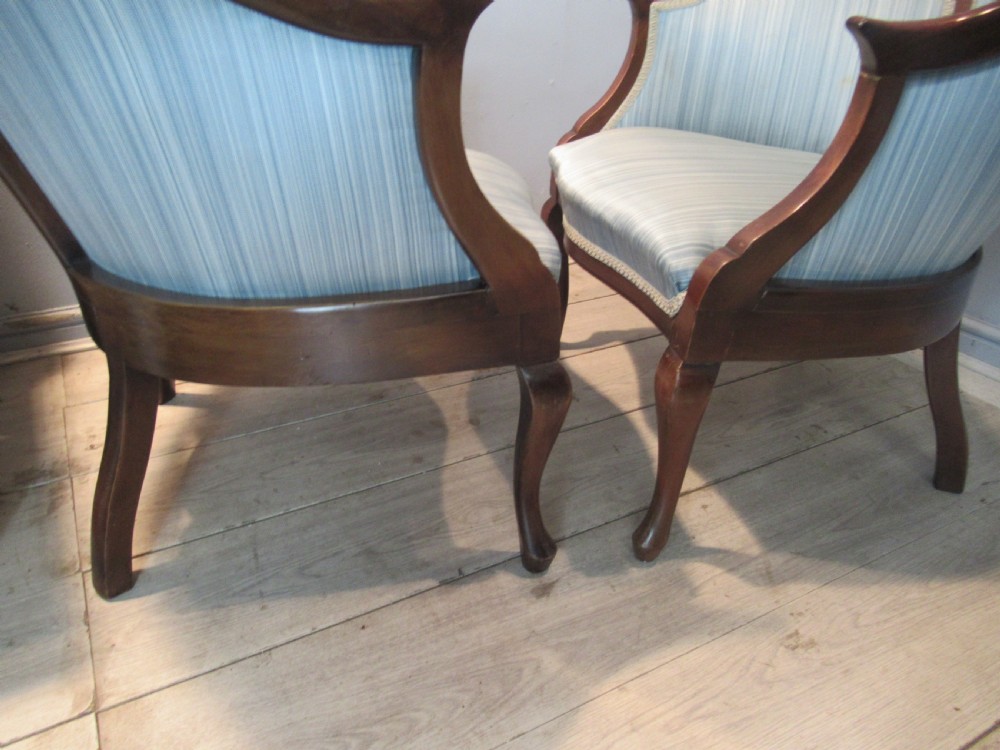 A similar  pair of Edwardian  mahogany arm chairs View VII