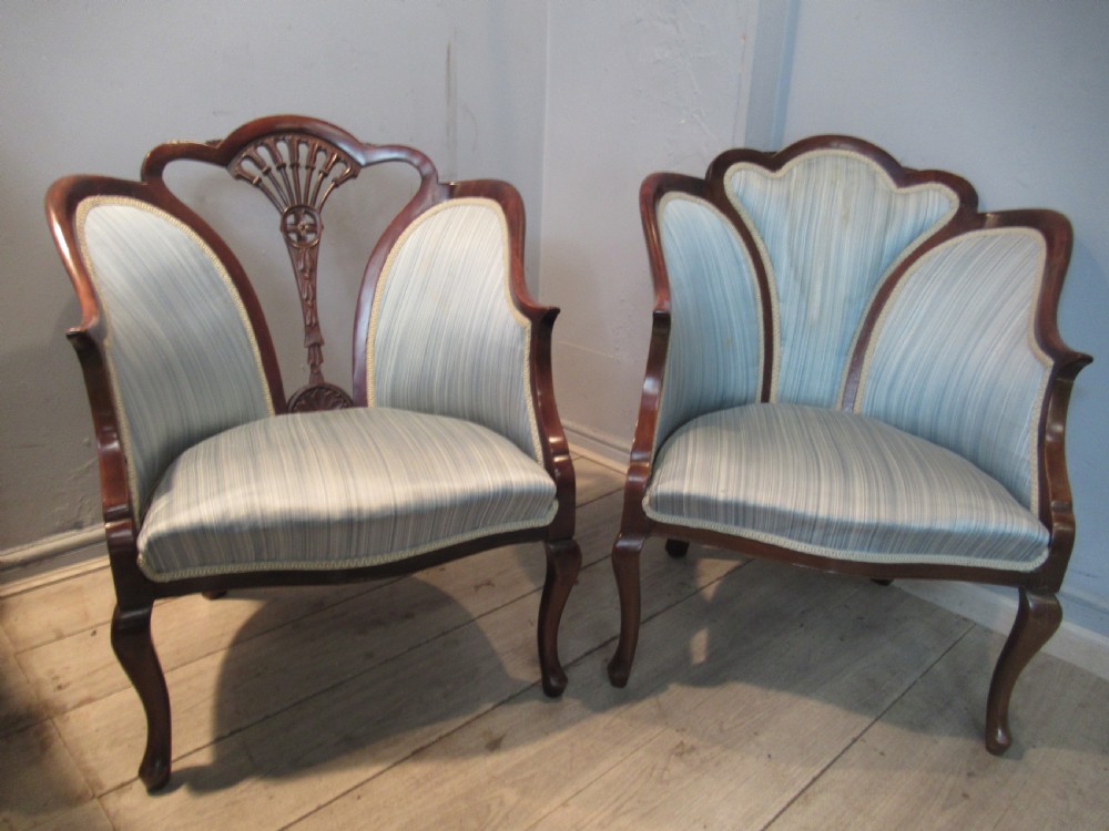 A similar  pair of Edwardian  mahogany arm chairs View VIII