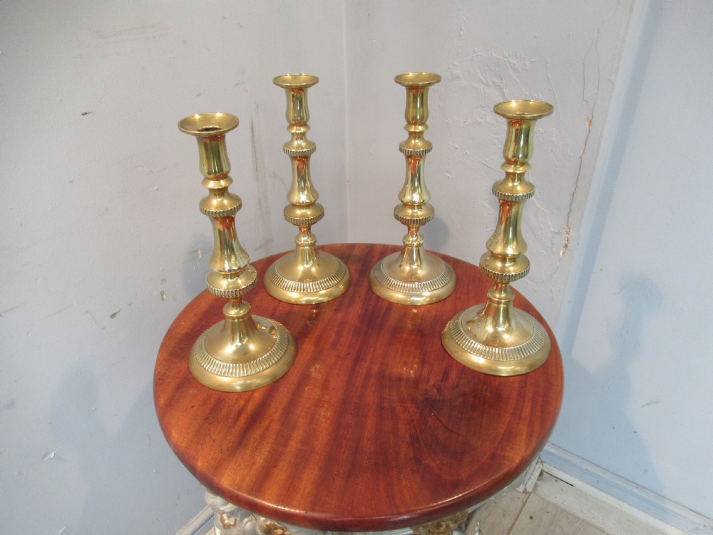 Set of four  large Victorian   brass candle sticks