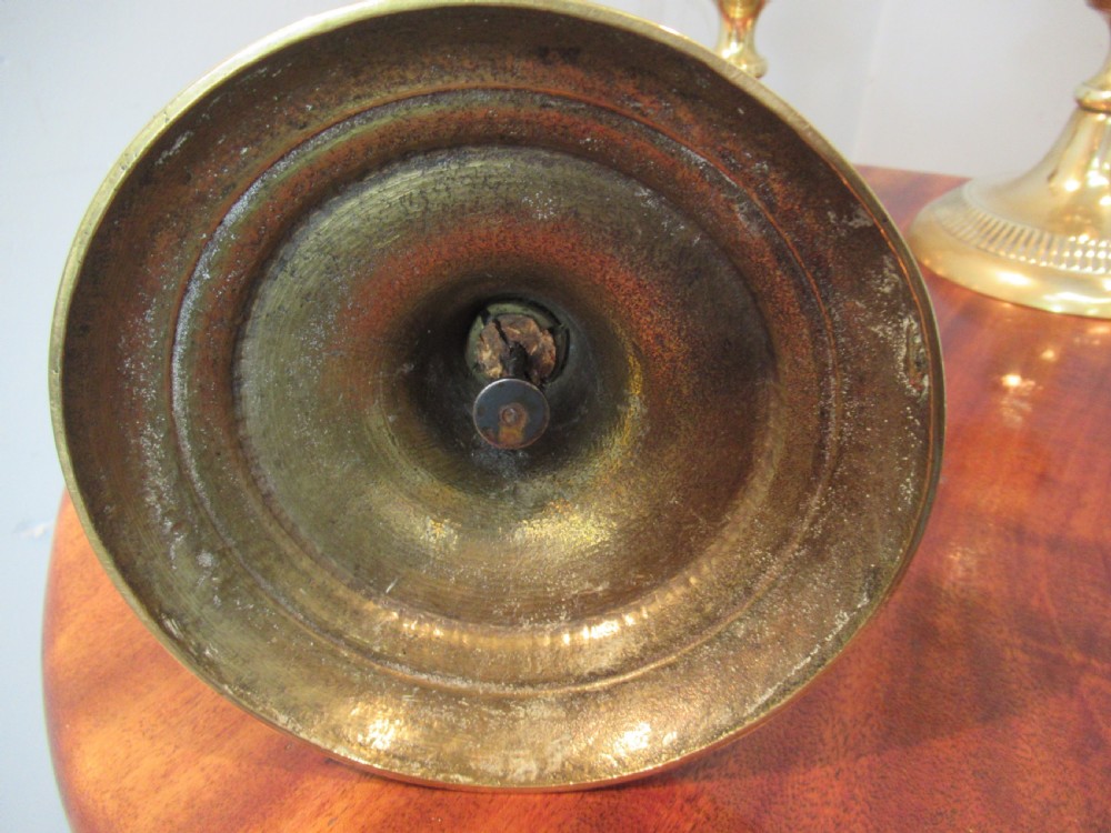 Set of four  large Victorian   brass candle sticks View V