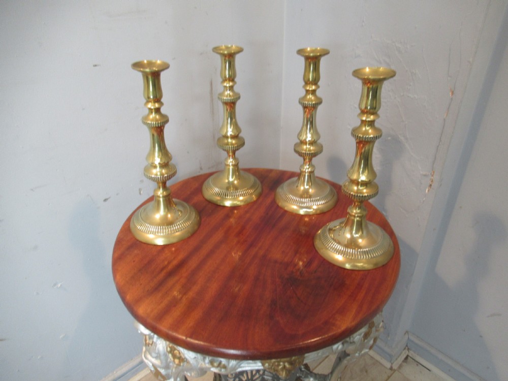 Set of four  large Victorian   brass candle sticks View VI