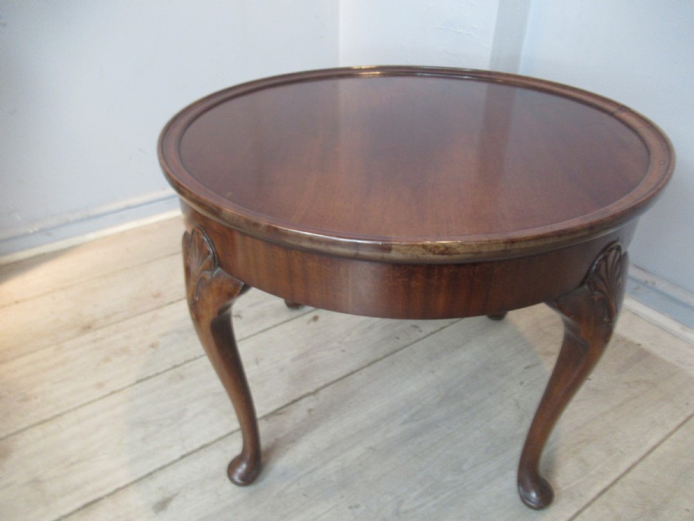 Round mahogany coffee table by Waring and Gillows