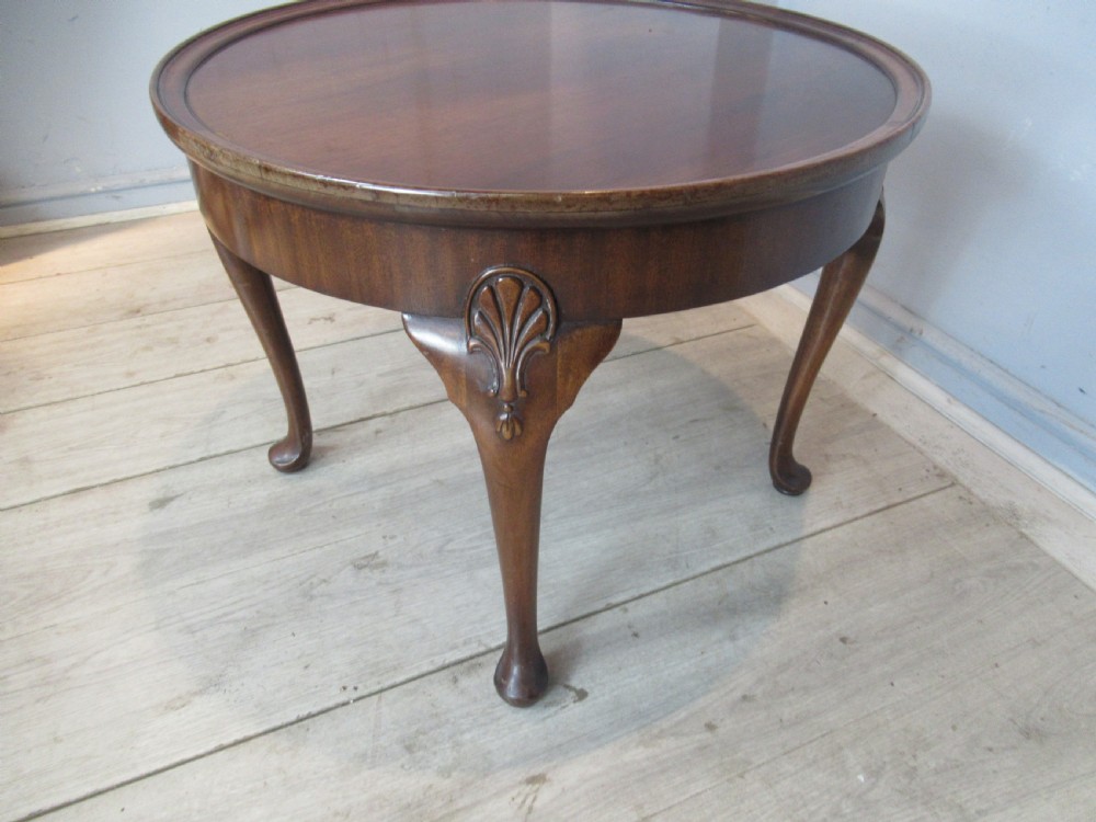 Round mahogany coffee table by Waring and Gillows View V