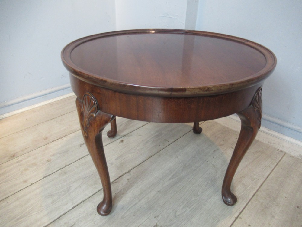 Round mahogany coffee table by Waring and Gillows View VI