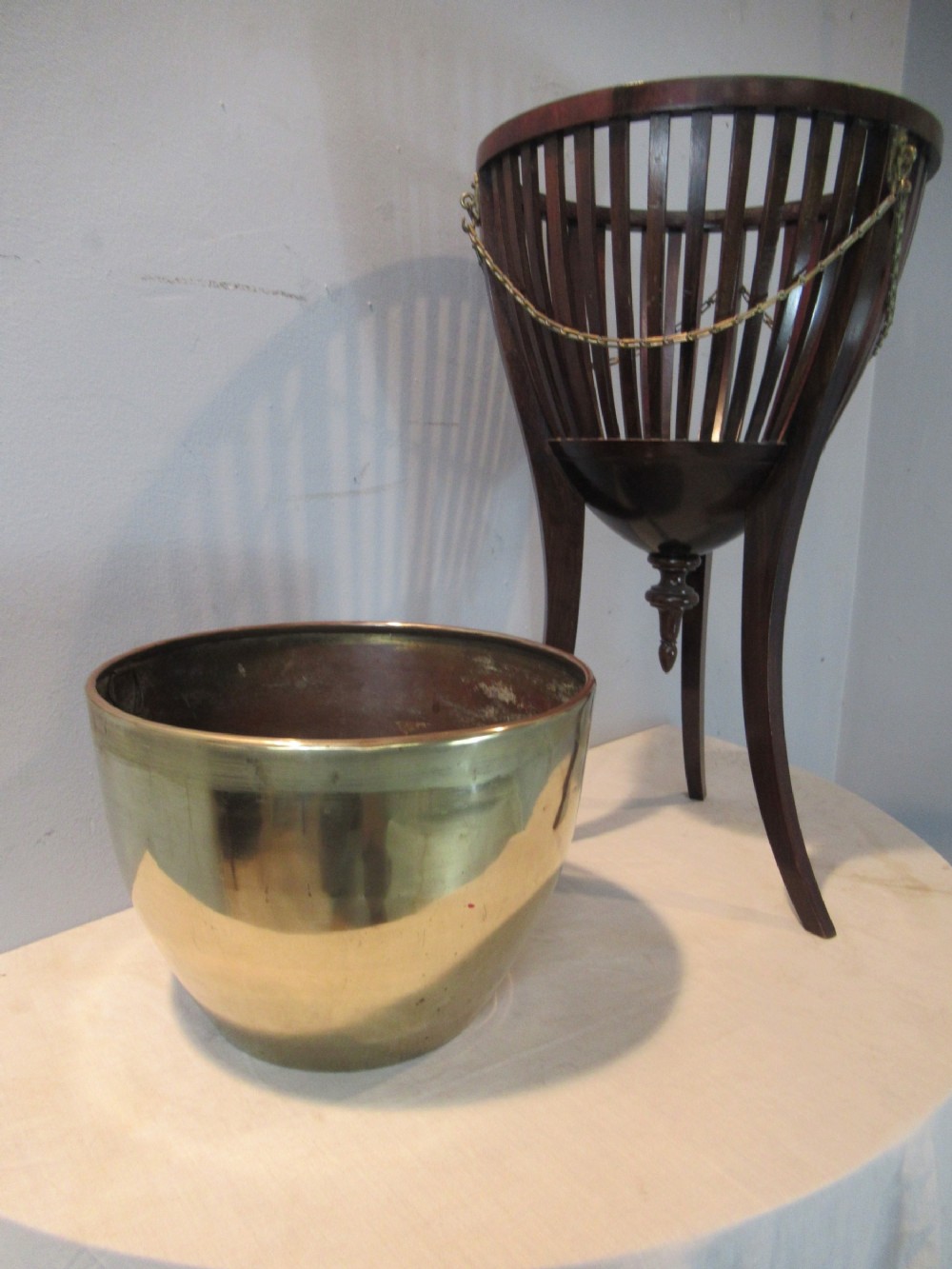 Edwardian period mahogany and brass plant stand