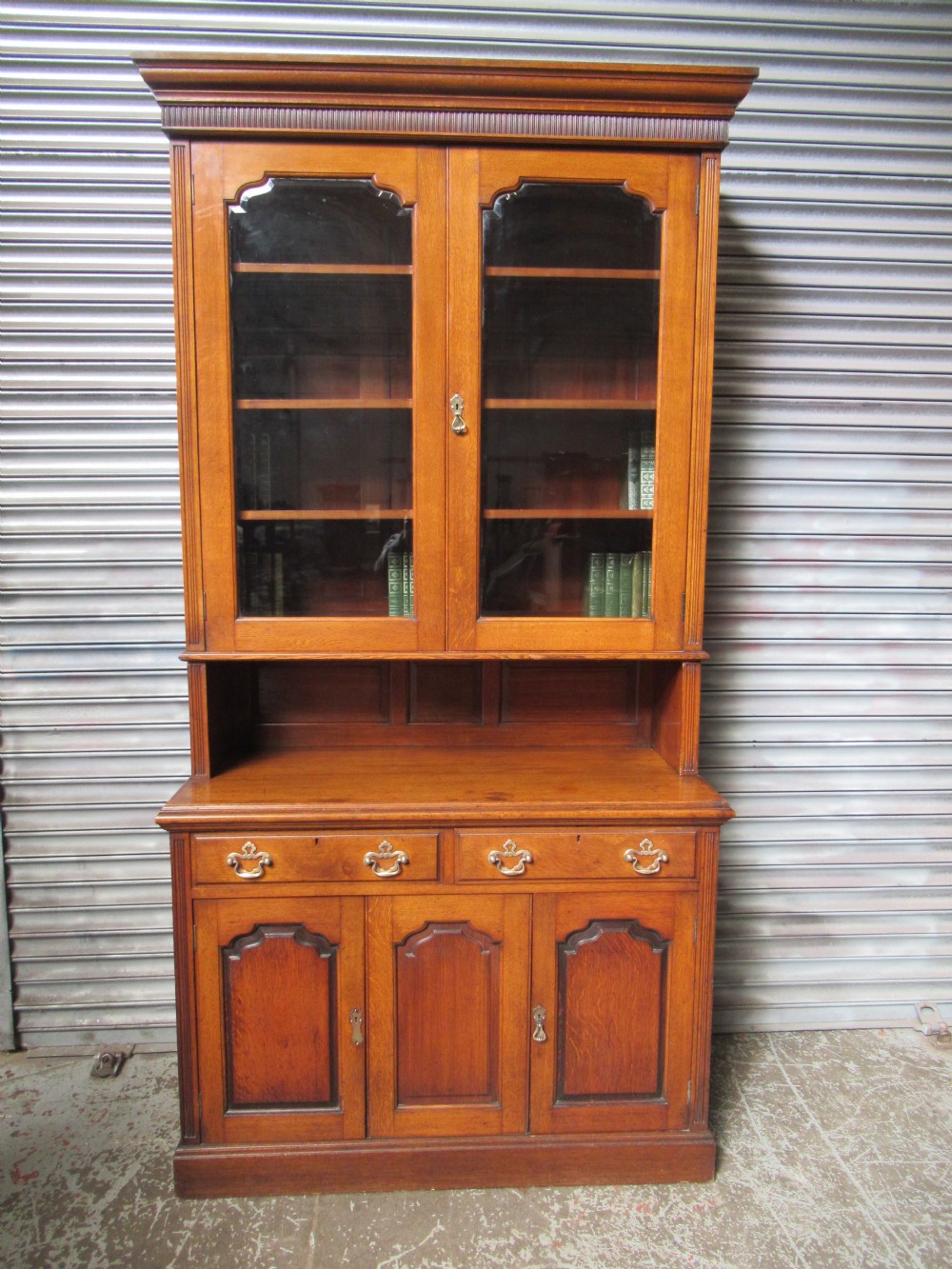 Late Victorian oak cupboard bookcase