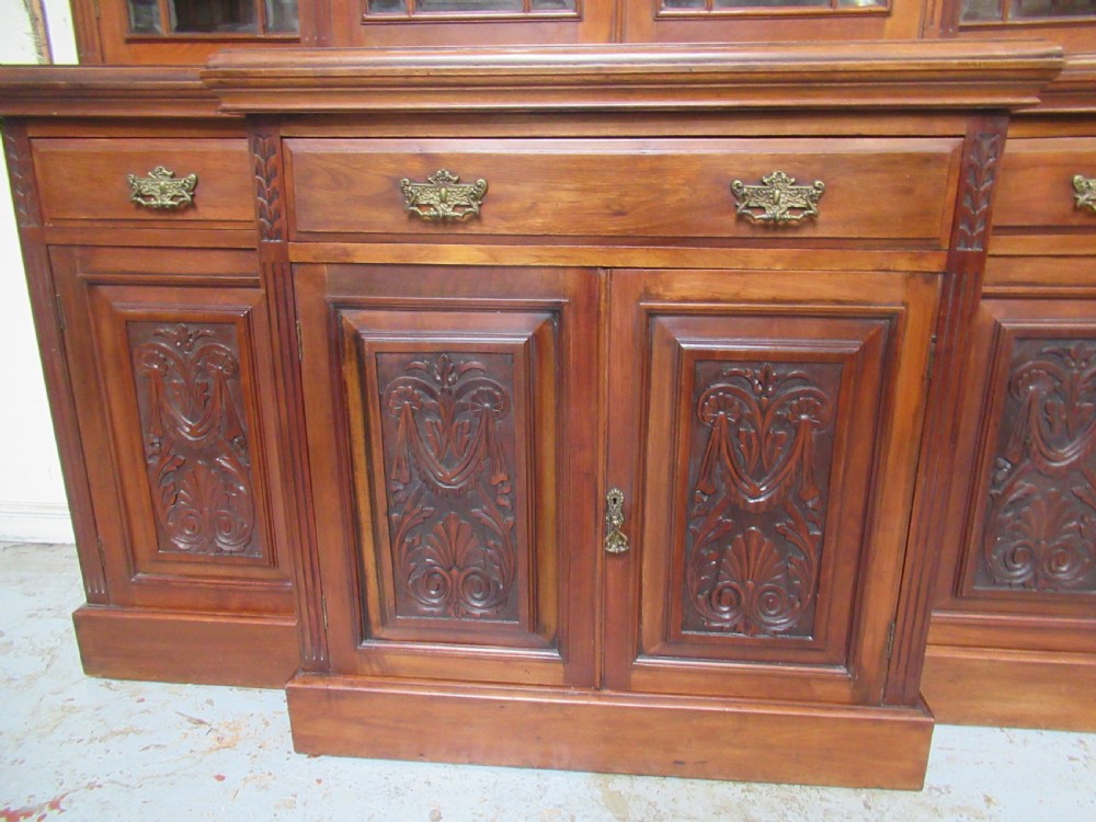 Late Victorian walnut break front bookcase View IX