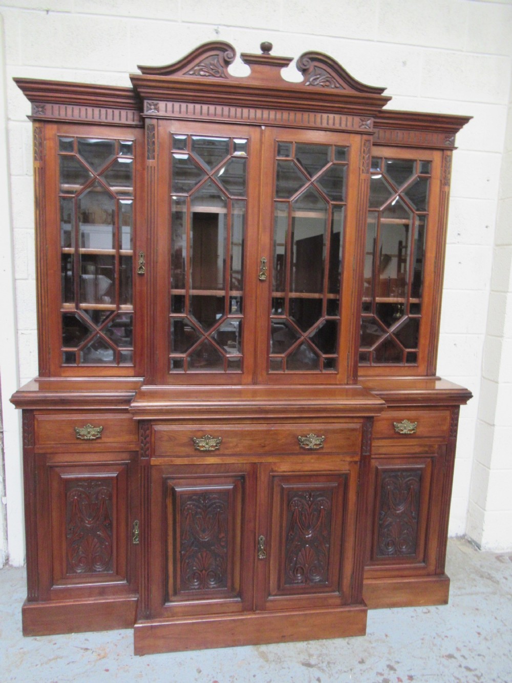 Late Victorian walnut break front bookcase