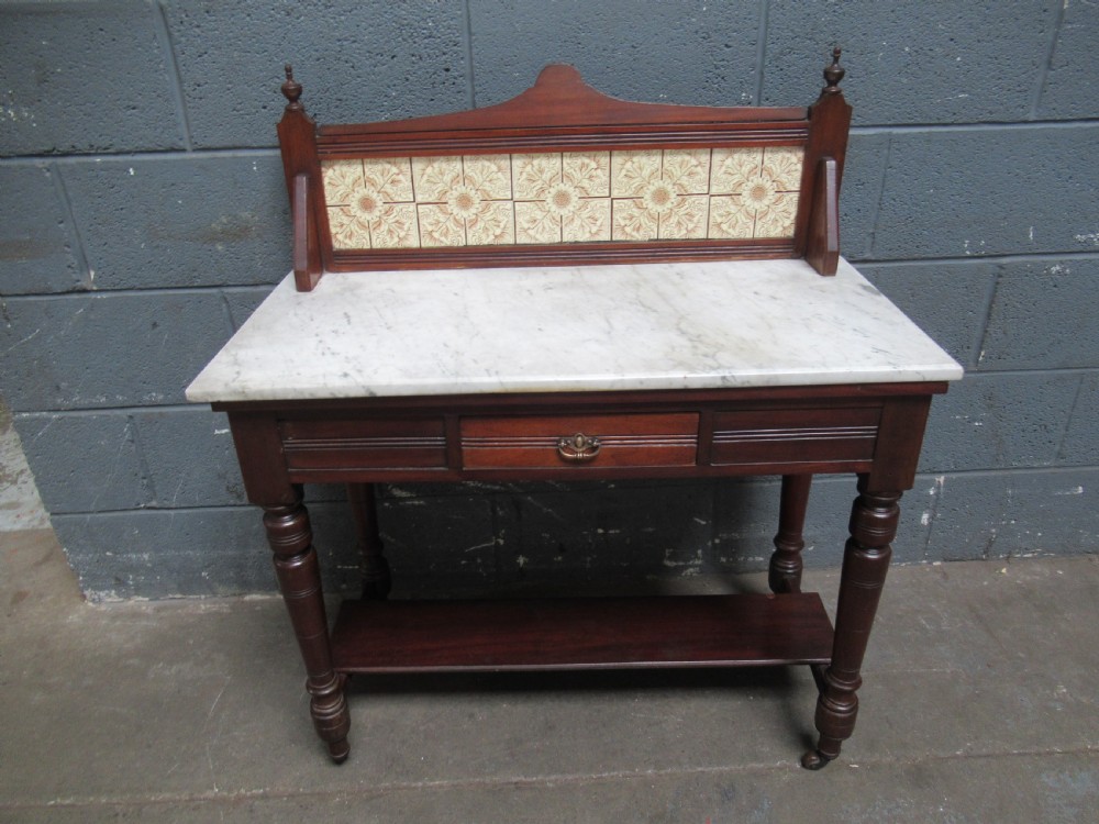Late Victorian mahogany marble and tile back washstand