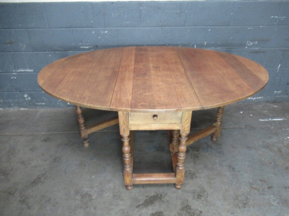Light oak drop leaf six seat dining table View IX