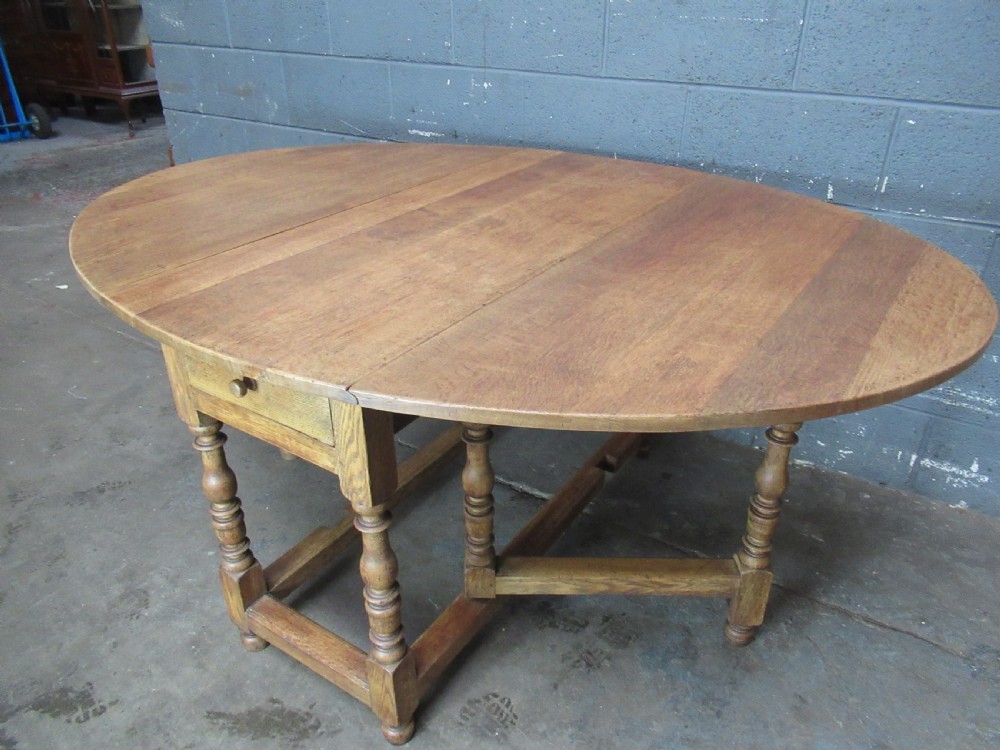 Light oak drop leaf six seat dining table View X
