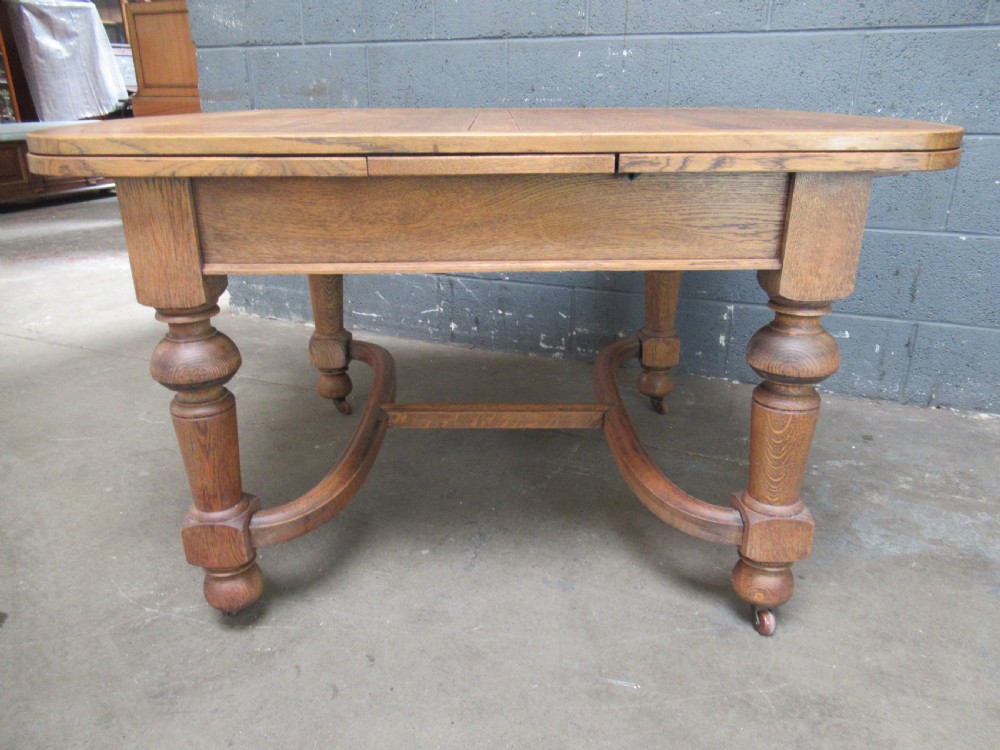 Oak Extending   dining table to seat six View VI