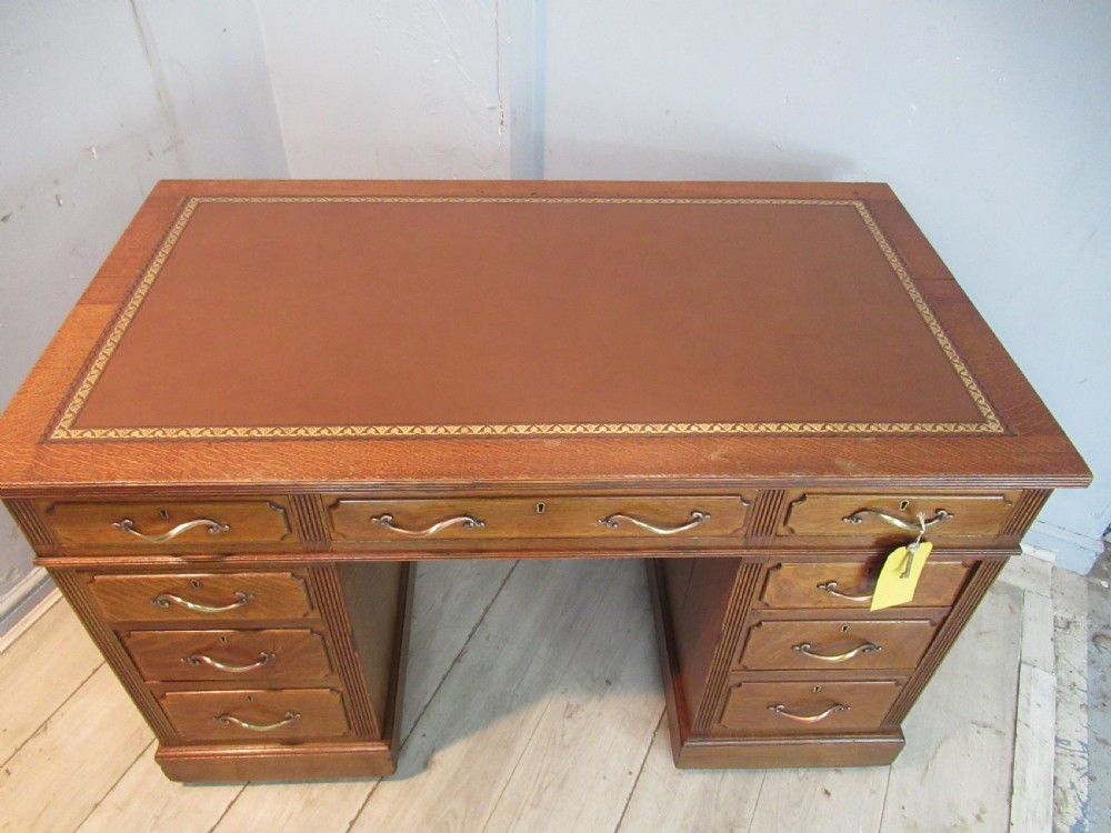 Edwardian period oak knee hole desk by Maple &co London