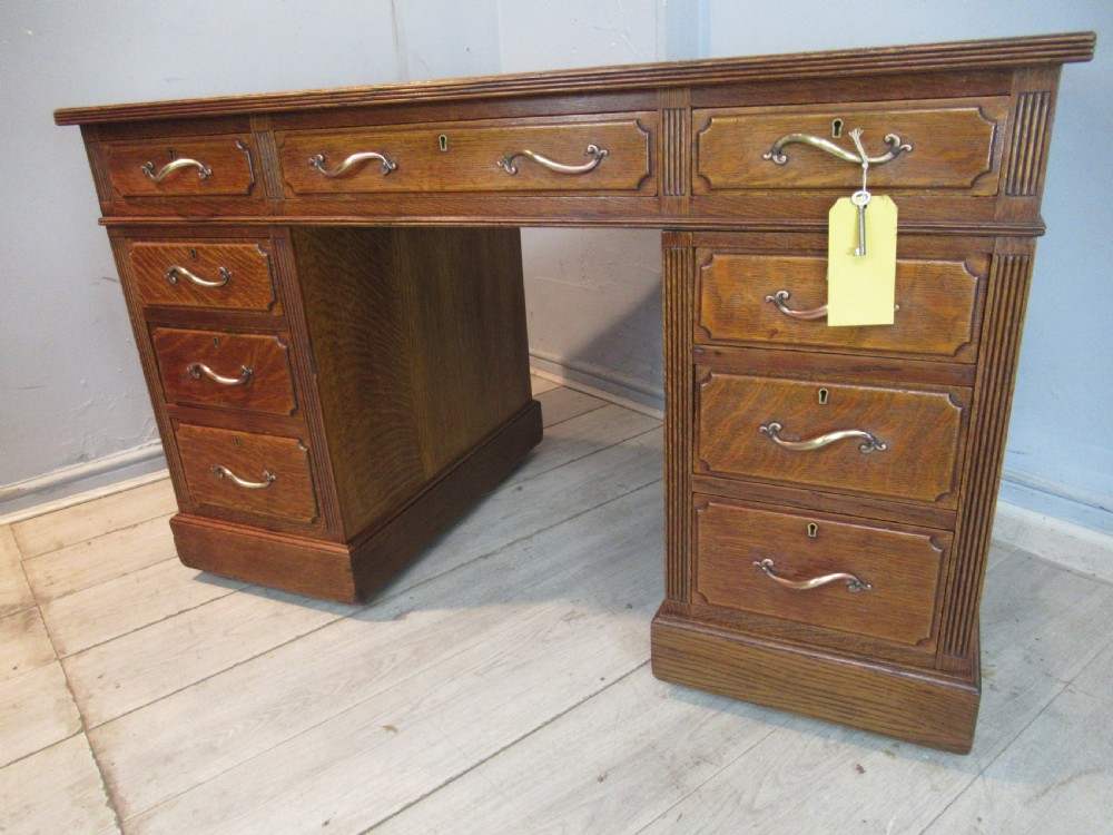 Edwardian period oak knee hole desk by Maple &co London View II