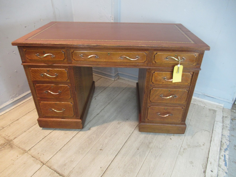 Edwardian period oak knee hole desk by Maple &co London View IV