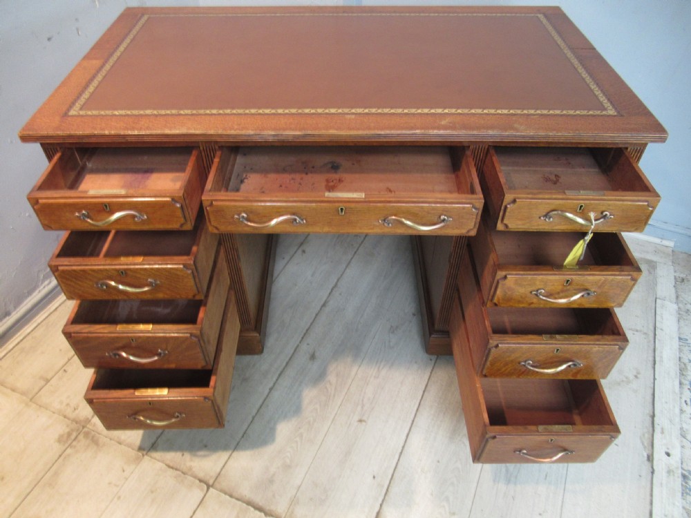 Edwardian period oak knee hole desk by Maple &co London View XII