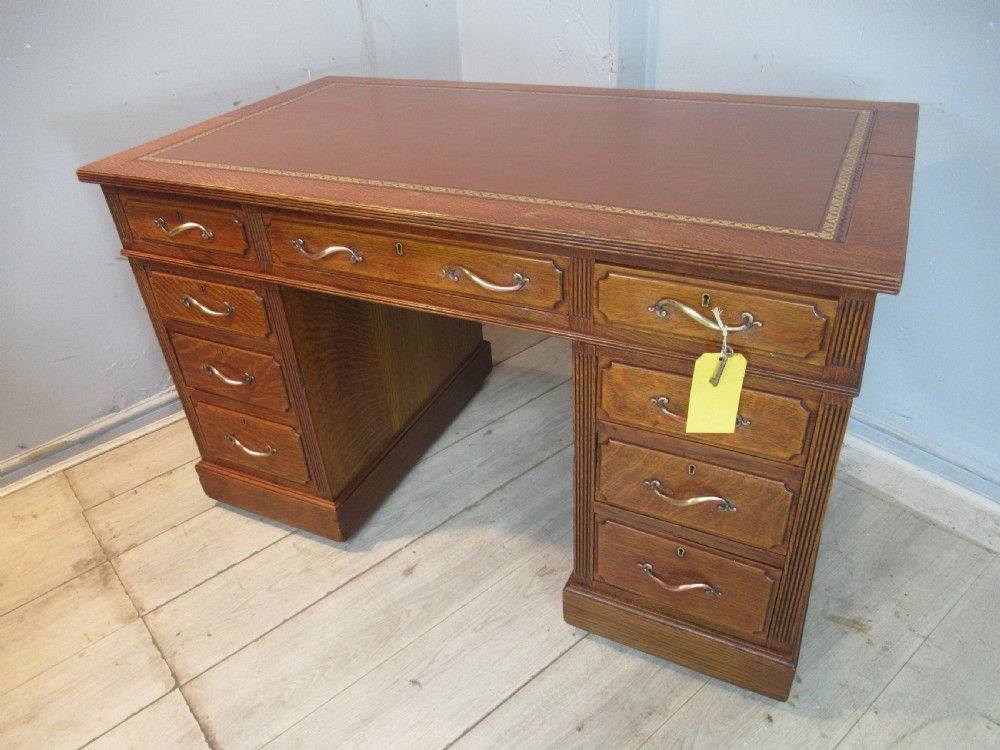 Edwardian period oak knee hole desk by Maple &co London View XVI