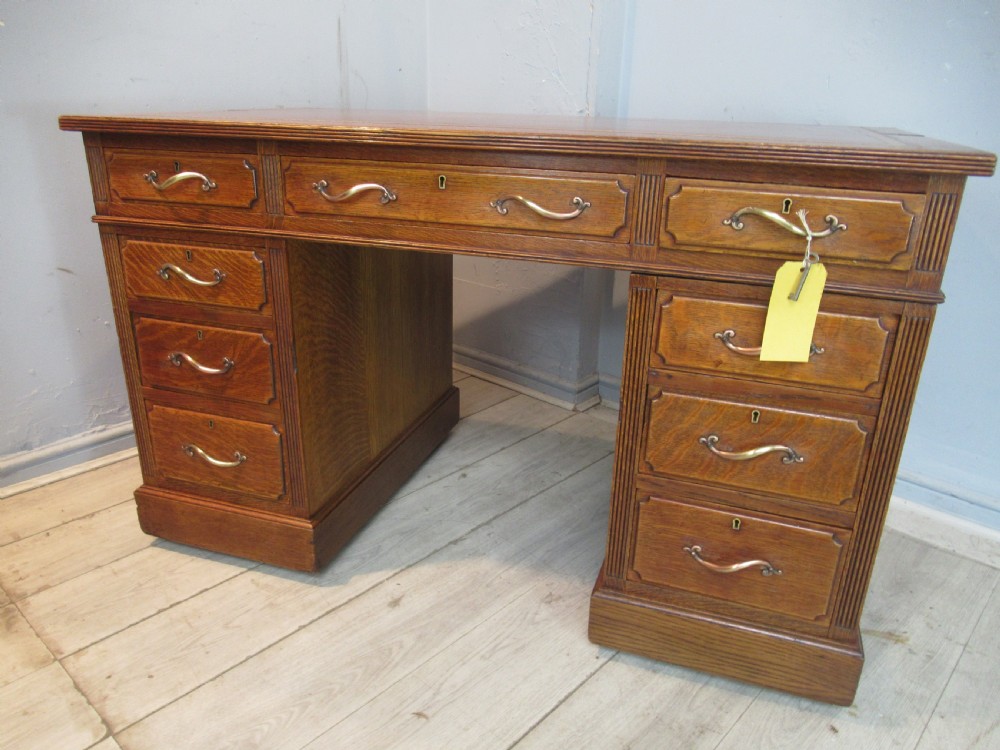 Edwardian period oak knee hole desk by Maple &co London View XVII