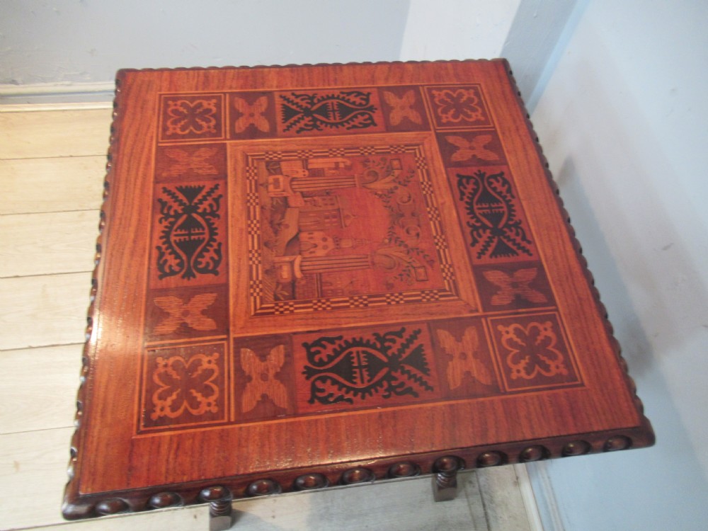 A 19th-century rich brown wood side table featuring a single drawer with marquetry inlay, carved bead edging, turned legs, and an inlaid lower shelf. View II