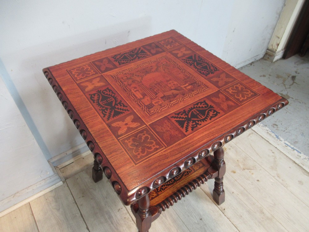 A 19th-century rich brown wood side table featuring a single drawer with marquetry inlay, carved bead edging, turned legs, and an inlaid lower shelf. View III