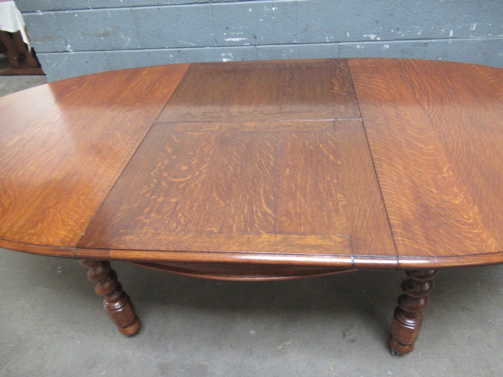 Oval oak extending dining table and set of six  dining chairs View IV