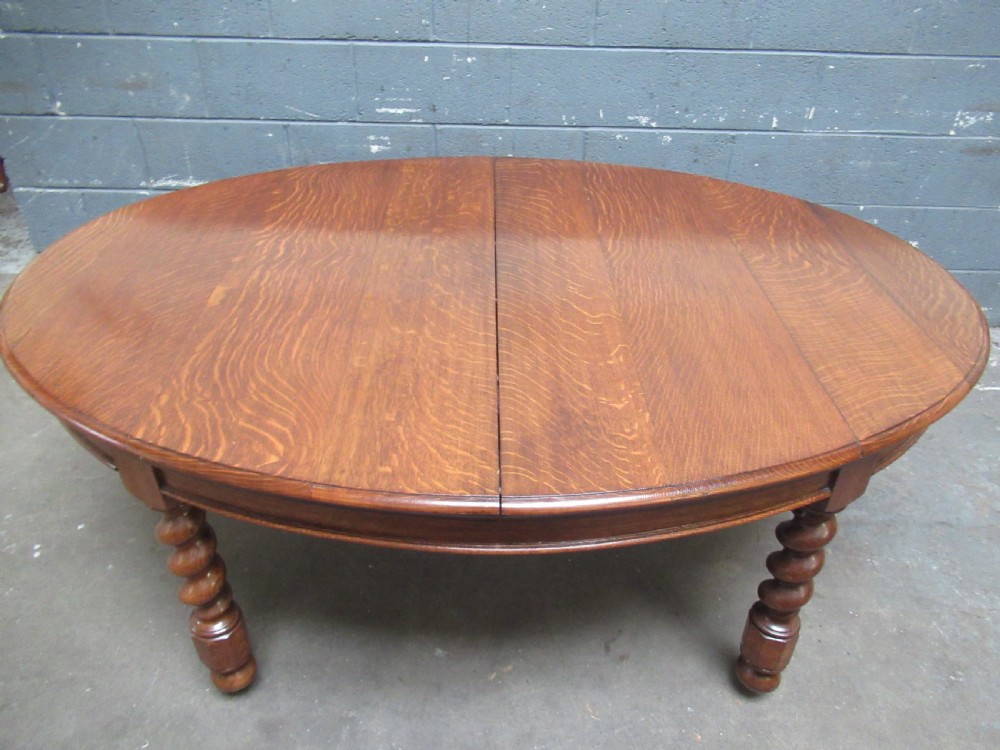 Oval oak extending dining table and set of six  dining chairs View VII