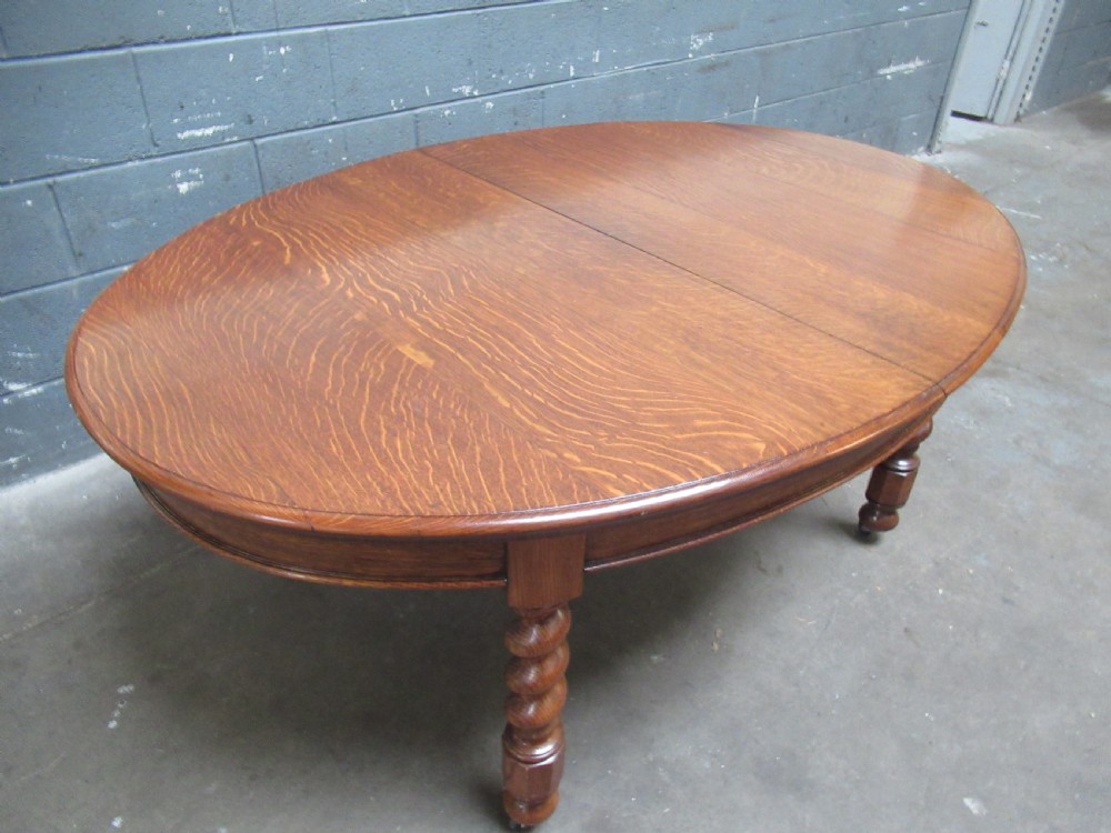 Oval oak extending dining table and set of six  dining chairs View VIII