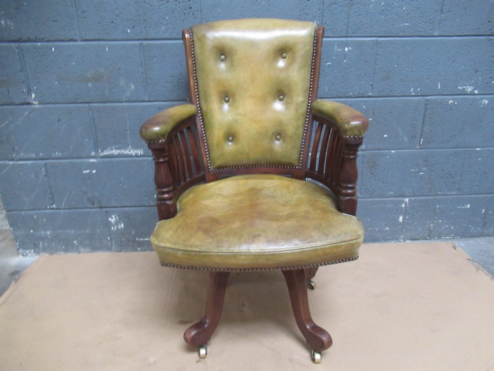 19th Century  mahogany swivel arm chair