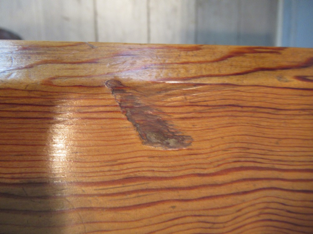 A Victorian pitch pine side table with a rectangular top, scalloped apron, and trestle supports joined by a stretcher with a carved quatrefoil motif. View VII