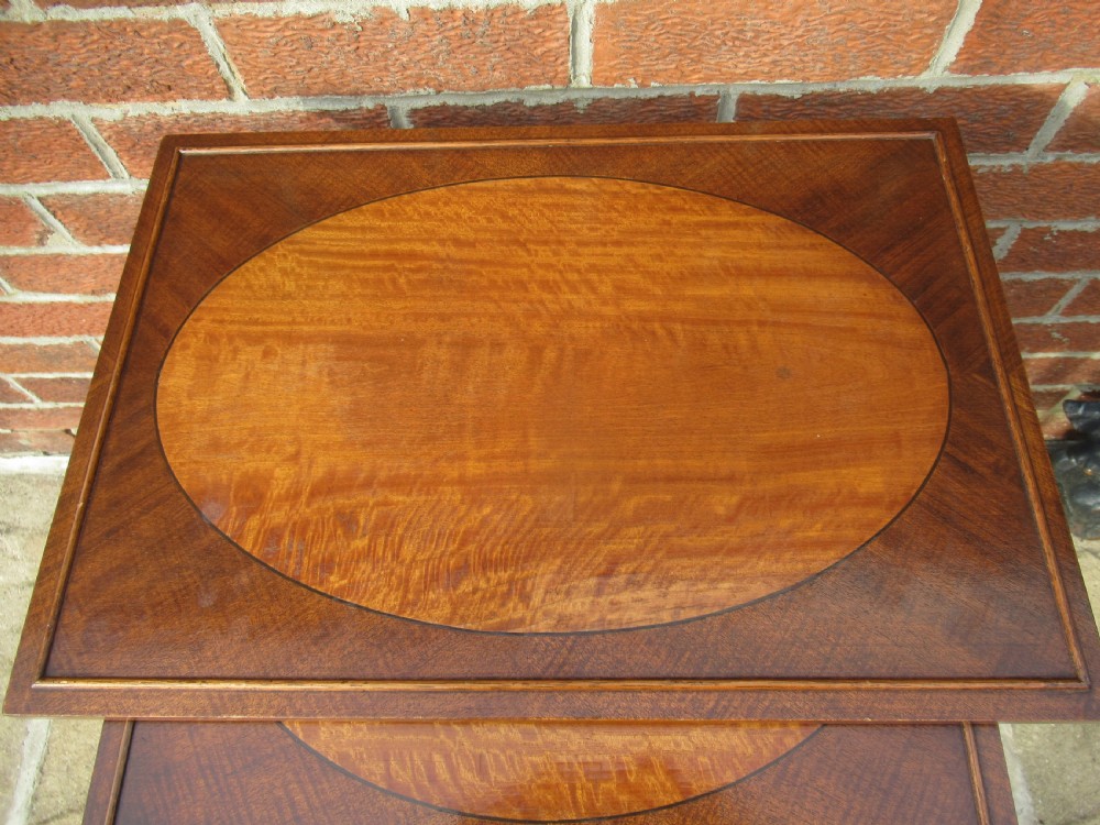 Nest of four mahogany and maple    side tables View IV
