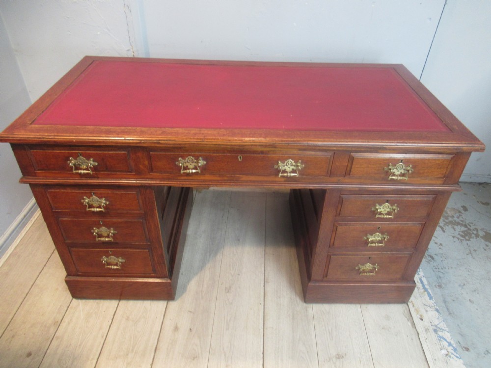 Late Victorian period oak knee hole desk