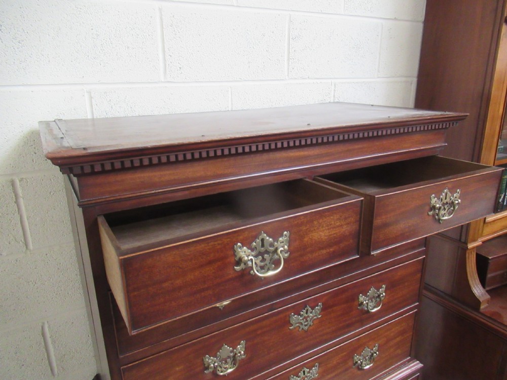 A late eighteenth-century Georgian mahogany tallboy chest on chest featuring a upper and lower section with brass handles and bracket feet. View XIII